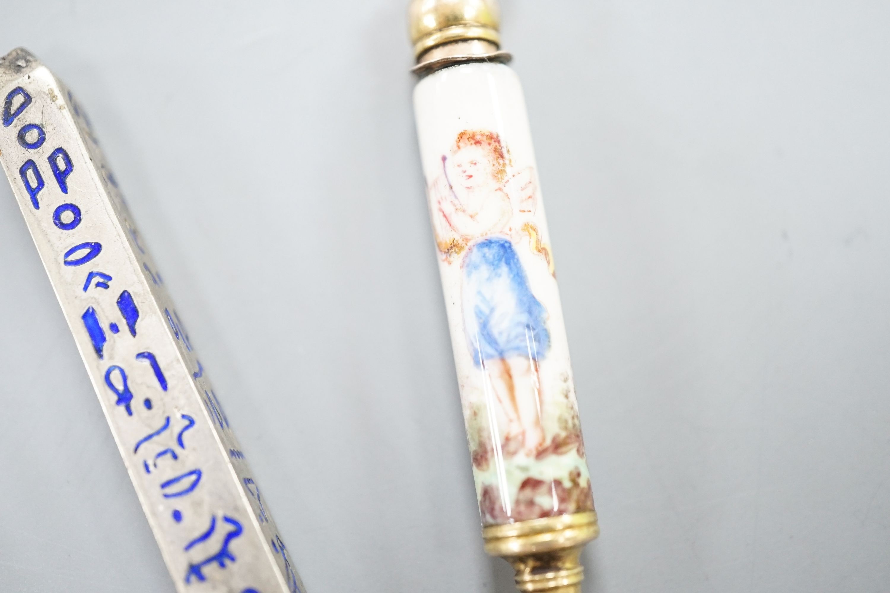 Four assorted pencils, including three enamelled and novelty modelled as an axe